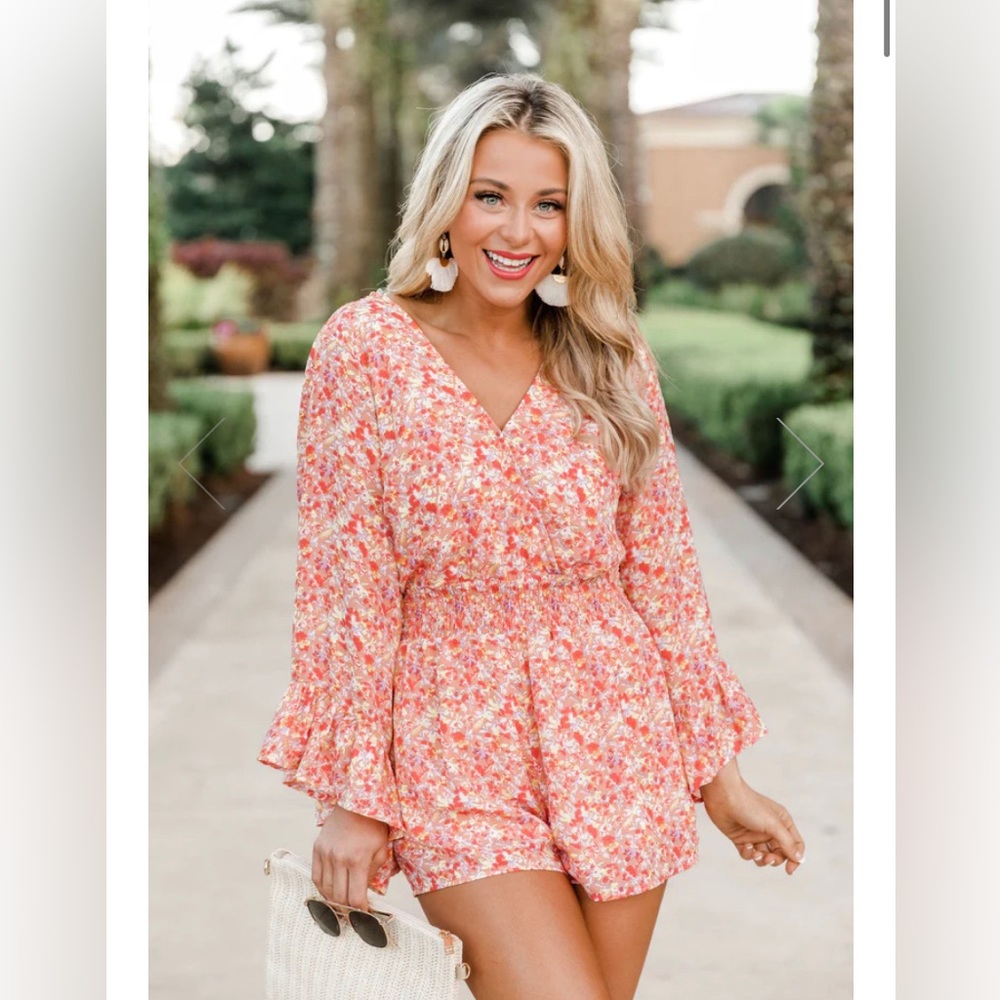 Super cute, never worn floral romper with long sleeves